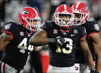  ?? BRYNN ANDERSON/AP 2020 ?? Despite some rumors about an injury concern, linebacker Azeez Ojulari (13), celebratin­g one of his 14.5 sacks, is expected to be the first UGA player selected in this week’s NFL draft.