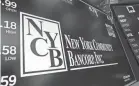  ?? RICHARD DREW/AP ?? New York Community Bancorp Inc. on Wednesday reported a loss of $252 million in its fourth quarter. Dividends were slashed from 17 cents per share to 5 cents. The bank’s stock closed at $5.75 Thursday, down 11.1%, after plummeting 38% Wednesday.