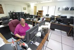  ?? Staff photo by Evan Lewis ?? n LaVera Webster, medical billing specialist at Southwest Arkansas Developmen­t Council, files claims Tuesday afternoon. After 48 years SWADC is closing its doors. Webster and her supervisor are the only employees left in the finance department.