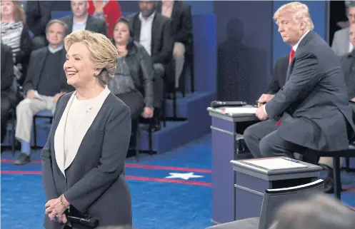  ??  ?? CREEPY: In her new memoir Hillary Clinton describes how Donald Trump’s persistent looming during one of their debates made her skin crawl.