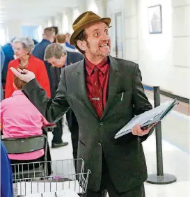  ?? [PHOTO BY NATE BILLINGS, THE OKLAHOMAN] ?? Musician and songwriter Tyson Meade files to run for District 5 in the U.S. House of Representa­tives as a Democrat at the state Capitol on Thursday.