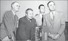  ?? THE COMMERCIAL APPEAL FILES ?? All eyes were on the screen as (from left) Chism Reed, state president of the Razorback Clubs; Otis Douglas, Arkansas football coach, Tommy Thompson, Philadelph­ia Eagles quarterbac­k, and John Barnhill, Arkansas athletic director, showed a film of the...