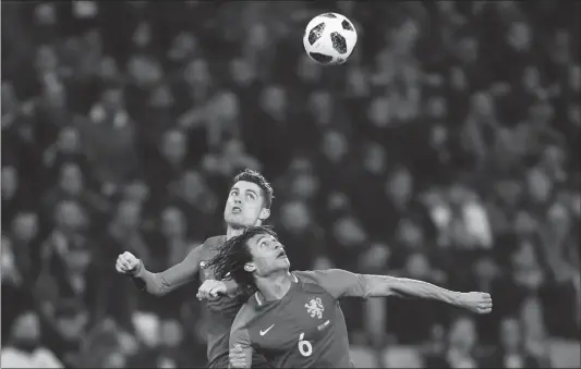  ?? Photo: VCG ?? Portugal’s Cristiano Ronaldo (left) fights for the ball with the Netherland­s’ Nathan Ake during their internatio­nal friendly match at Stade de Geneve stadium in Geneva on Monday.