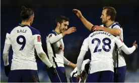  ??  ?? Tanguy Ndombele celebrates with his Tottenham teammates after scoring his second in injury time. Photograph: Tottenham Hotspur FC/Getty Images