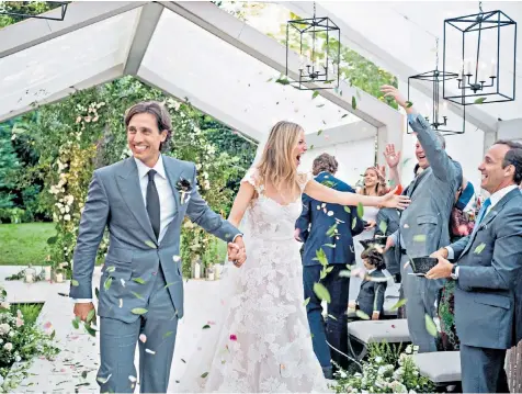  ??  ?? Gwyneth Paltrow shares the first picture of her wedding to Brad Falchuk. Her dress was a Valentino lace creation embroidere­d with flowers