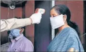  ?? HT PHOTO ?? ■
Finance minister Nirmala Sitharaman wearing a mask is screened as she arrives to resume work from her office on Monday.