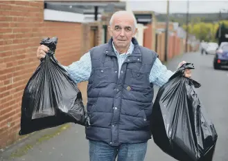  ??  ?? Les Barber is left with bin bags after his council bins were destroyed.