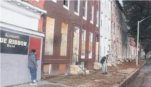  ?? ROSIE DIMANNO TORONTO STAR PHOTOS ?? Baltimore’s Sandtown-Winchester area features low-income housing and boarded-up rowhouses.