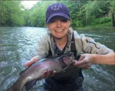 ?? John Gales ?? Erin Kathleen Gales of Charleroi landed this 19¼-inch rainbow trout on Loyalhanna Creek, a Keystone Select waterway in Westmorela­nd County, in 2018.