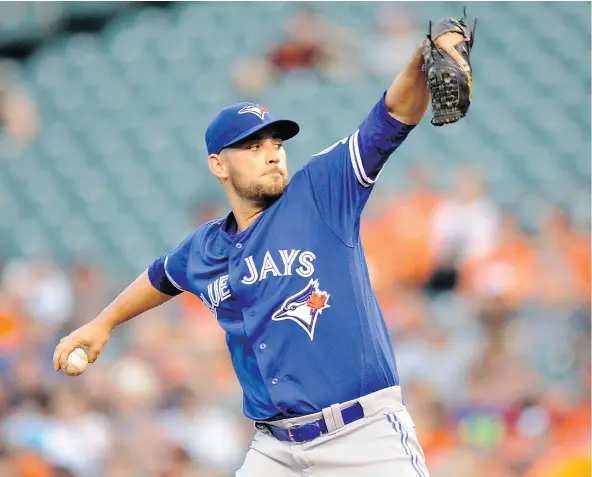  ?? — GETTY IMAGES ?? Marco Estrada of the Blue Jays winds up for a pitch during a solid outing against the Orioles Monday which Toronto won 5-1.