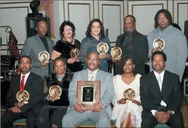  ?? KIM ROBINSON — LEAGUE OF MARTIN VIA AP ?? Lenard Wells, front row center, receives an award in April of 2008 from an organizati­on he led to promote the hiring of African-American officers in the Milwaukee Police Department called the League of Martin. Wells, a former Milwaukee police lieutenant and a mentor to many in the black community, died of the new coronaviru­s.