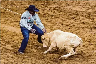  ?? Marvin Pfeiffer/Staff photograph­er ?? In this year’s tie-down roping rounds at the rodeo, Douch competed with fellow Black cowboys Mayfield and Cory Solomon, a nine-time qualifier.