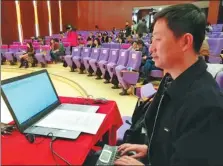  ?? PROVIDED TO CHINA DAILY ?? Li Zhengjie works as a stenograph­er at an acdemic seminar at Beijing’s Tsinghua University in March.