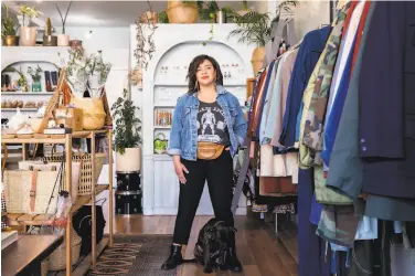  ?? Jessica Christian / The Chronicle ?? Morgan Mapes says her Golden Hour vintage clothing store on Clement Street “has weathered the storm.”