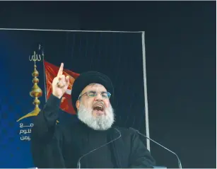  ?? (Aziz Taher/Reuters) ?? HEZBOLLAH CHIEF Hassan Nasrallah speaks to supporters in south Beirut yesterday.