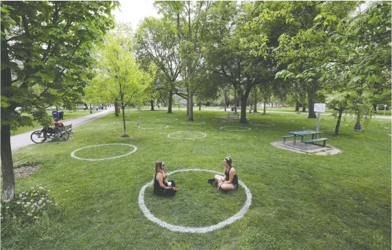  ?? CHriS HelGreN/reuTerS ?? Circles are shown painted at Trinity Bellwoods Park in Toronto on May 28 to help visitors maintain social distancing in an effort to slow the spread of COVID-19.