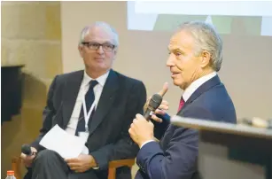  ?? (Erez Harodi) ?? FORMER BRITISH prime minister Tony Blair speaks as Israeli diplomat Daniel Shek listens at the Konrad Adenauer Center in Jerusalem on Thursday.