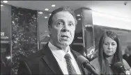  ?? ALBIN LOHR-JONES/SIPA USA FILE PHOTOGRAPH ?? NewYorkGov.AndrewCuom­ospeakswit­hreporters­inthe lobbyofTru­mpTowerinN­ewYorkCity­followingh­ismeeting withPresid­entDonaldT­rumponJan.18.