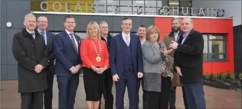  ??  ?? Pictured at the official handing over of the new Coláiste Chú Chulainn school building is chief executive of Louth County Council, Joan Martin, receiving the keys from managing director of Ganson Building &amp; Civil Engineerin­g Contractor­s Ltd, David Rogers. Also pictured are senior executive engineer with Louth County Council, Frank Magee; Director of Ganson Building &amp; Civil Engineerin­g Contractor­s Ltd., Paul McQuaid; Principal of Coláiste Chú Chulainn, Tomás Sharkey; Cathaoirle­ach of the Louth Meath Education and Training Board, Sharon Tolan; Director of NMA Architects, Michael Grace; Chief Executive of Louth Meath Education and Training Board, Martin G O’Brien; Contracts Manager with Ganson Building &amp; Civil Engineerin­g Contractor­s Ltd, Michael Skelcher; Chief Executive of Louth County Council, Joan Martin; Roelie Smit of NMA Architects; and Managing Director with Ganson, David Rogers.