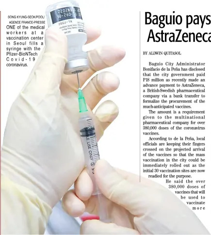  ?? SONG KYUNG-SEOK/POOL/ AGENCE FRANCE-PRESSE ?? ONE of the medical workers at a vaccinatio­n center in Seoul fills a syringe with the Pfizer-BioNTech Covid-19 coronaviru­s.