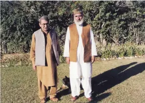  ?? — AFP ?? An undated photograph shows prominent Pakistani Pashtun leader Afzal Khan Lala, right, posing for a photograph with a friend in Swat Valley. A Pakistani nationalis­t hero who defied the Taliban in Swat Valley and survived more than 10 assassinat­ion...