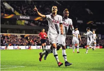  ?? Reuters ?? Making a point Tottenham’s Erik Lamela (left) celebrates with Clinton Njie after scoring his team’s third goal and completing his hat-trick during their Uefa Europa League match against AS Monaco.
