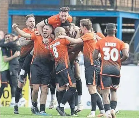  ?? ?? Peterborou­gh Sports celebrate their winning goal at King’s Lynn. Photos Darren Wiles.