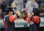  ?? TONY DEJAK — THE ASSOCIATED PRESS ?? Francisco Lindor, right, celebrates with Giovanny Urshela after both scored on a two-run home run by Lindor in the fifth inning against the Royals on Aug. 25.