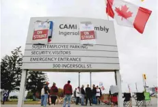  ?? — Reuters ?? Striking members of the auto workers union Unifor stand on a picket line outside the GM CAMI assembly plant in Ingersoll, Ontario.