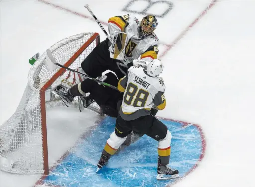  ?? Jason Franson The Associated Press ?? Arizona’s Taylor Hall, attempting to establish a net presence, finds a rude reception from Knights goaltender Marc-andre Fleury and defenseman Nate Schmidt.