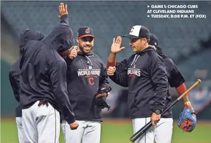  ?? KEN BLAZE, USA TODAY SPORTS ?? uGAME 1: CHICAGO CUBS AT CLEVELAND INDIANS uTUESDAY, 8:08 P.M. ET (FOX) Jason Kipnis, center, and fellow Indians infielders share a laugh during a workout Monday at Progressiv­e Field.