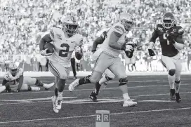  ?? ADAM CAIRNS Kyle Robertson ?? Ohio State Buckeyes running back J.K. Dobbins averaged 6.2 yards per carry in three seasons and scored 38 touchdowns. The Dolphins interviewe­d him before the lockdown.