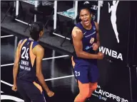  ?? Julio Aguilar / Getty Images ?? The Sun’s Alyssa Thomas, right, celebrates with DeWanna Bonner after converting a steal in the fourth quarter against the Aces during Game 3 on Thursday.