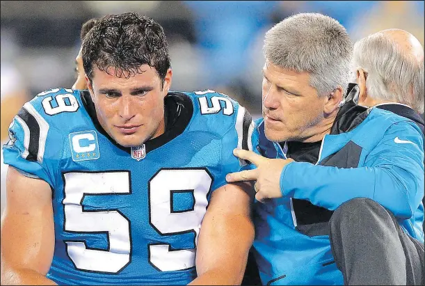  ?? GETTY IMAGES ?? Carolina Panthers linebacker Luke Kuechly (left) is carted off the field after sustaining a concussion against the New Orleans Saints last season.