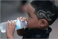  ?? PICTURE: REUTERS ?? A boy with a haircut symbolisin­g the number 9, which stands for the late King Bhumibol Adulyadej, also known as King Rama IX.