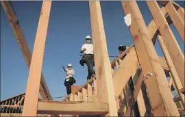  ?? Mark Boster Los Angeles Times ?? IT’S UNCLEAR whether the state’s goals for Southern California will be enough to address its shortage of available homes. Above, constructi­on in Irvine in 2014.