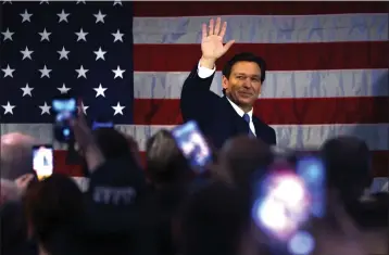  ?? SPENCER PLATT — GETTY IMAGES/TNS ?? Florida Gov. Ron DeSantis waves as he speaks to police officers about protecting law and order in the Staten Island borough of New York City on Feb. 20. He is scheduled to visit the Reagan Library in Simi Valley on Sunday.