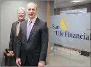  ?? Lorraine Hjalte/calgary Herald ?? Rod Gatenby, managing director real estate investment­s, left, and Scott Sharples, senior director real estate investment­s at Sun Life Financial.