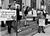  ?? LISA MASCARO/LOS ANGELES TIMES ?? Activists protest for Resist Trump Tuesdays at GOP Sen. Ron Johnson’s Wisconsin office.