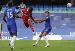  ?? — AP ?? Liverpool’s Sadio Mane ( centre) scores against Chelsea in their English Premier League match at Stamford Bridge in London on Sunday.