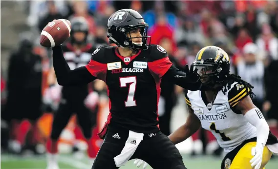  ?? JUSTIN TANG/THE CANADIAN PRESS ?? Redblacks quarterbac­k Trevor Harris threw a CFL playoff-record six touchdown passes in Ottawa’s East Division Final win over Hamilton on Sunday.