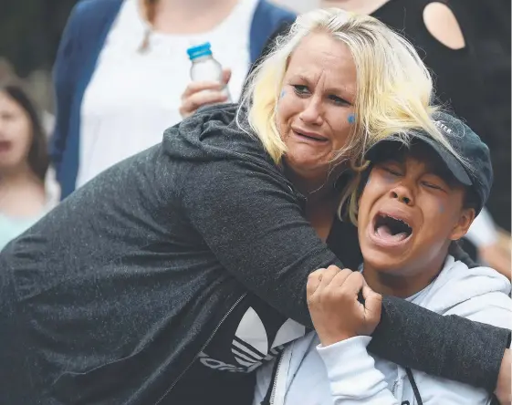  ?? Picture: GETTY ?? Supporters of terminally ill baby Charlie Gard break down after hearing the news his life support will be turned off.