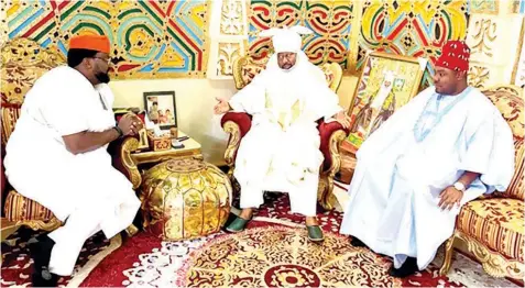  ?? PHOTO: NAN ?? Emir of Bichi, HRH Nasiru Ado Bayero, flanked by the Spokespers­on, House of Representa­tives, Akin Rotimi Jnr ( left) and Deputy Spokespers­on, Philip Agbese during a congratula­tory visit to the Emir’s palace on his 60th birthday, in Kano… yesterday.