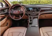  ??  ?? In the tested Premium trim, the LaCrosse comes with a classy interior highlighte­d by faux wood grain trim and leather accents.