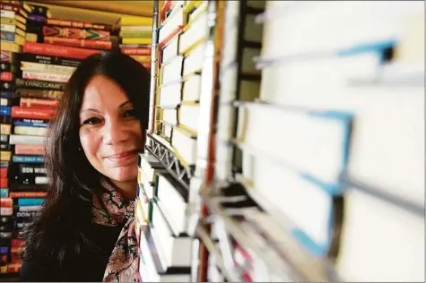  ?? H John Voorhees III/Hearst Connecticu­t Media ?? Michelle Smith on Thursday in the stacks at her new store, The BookSmiths Shoppe, which is opening in January at The Summit in Danbury.