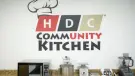  ?? ?? Mixers, food processors and other kitchen utensils sit on a counter below the HDC Community Kitchen logo on Thursday.