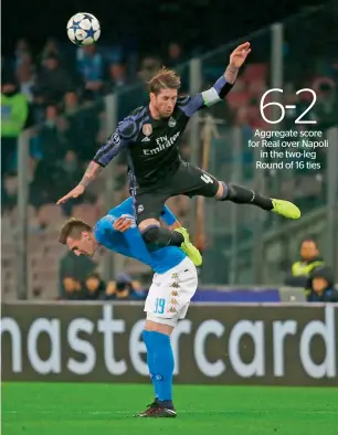  ?? Reuters ?? Real Madrid’s Sergio Ramos is airborne as he goes for a header against Napoli’s Arkadiusz Milik. Real won the Round of 16 second-leg match 3-1 on Tuesday night. —