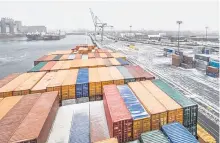  ?? POSTMEDIA NEWS ?? Shipping containers on a ship docked at the Port of Montreal.