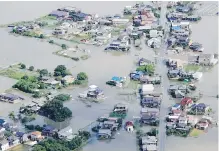  ??  ?? A flooded area in Kurume, Fukuoka prefecture, southern Japan, on Wednesday after the Chikugo River burst its banks.