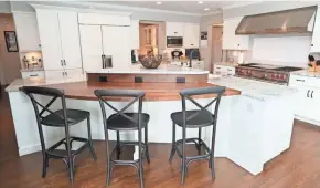  ??  ?? A separate eating area was built into the kitchen island.